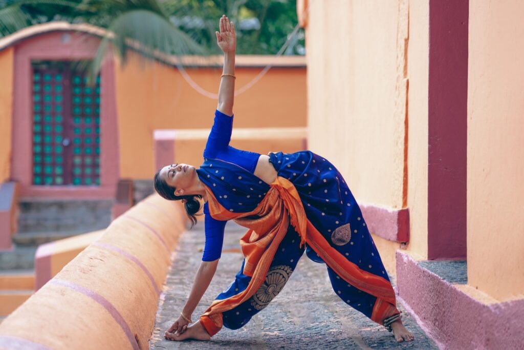 A Dance Student enjoying an online dance class, showcasing the benefits of dance such as fitness, flexibility, and joy, with participants following an instructor on a screen.